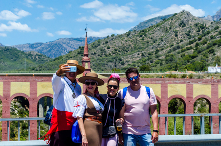 NERJA, SPAIN - 15 MAY, 2018 people participating in the Catholic ceremony of transferring the holy figure in Spainのeditorial素材