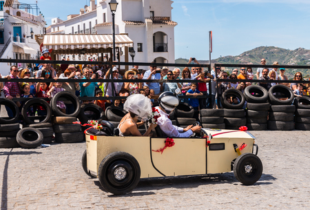 FRIGILIANA, SPAIN - MAY 13, 2018 "Autos Locos" - traditional fun involving the ride of cardboard cars in small spanish town, self-made vehicles, creative and cheerful eventのeditorial素材