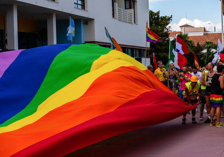 TORREMOLINOS, SPAIN - JUNE 2, 2018 LGBT march promoting equality and tolerance in a coastal town in Andaluciaのeditorial素材