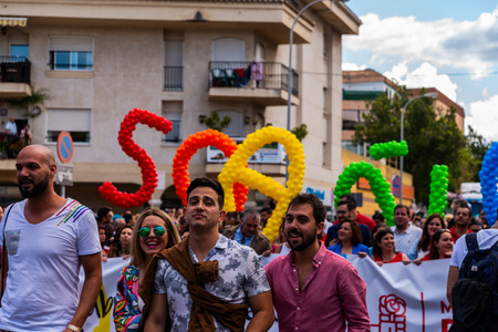 TORREMOLINOS, SPAIN - JUNE 2, 2018 LGBT march promoting equality and tolerance in a coastal town in Andaluciaのeditorial素材