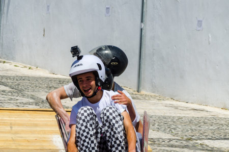 FRIGILIANA, SPAIN - MAY 13, 2018 Autos Locos - traditional fun involving the ride of cardboard cars...