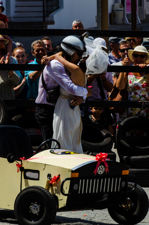 FRIGILIANA, SPAIN - MAY 13, 2018 "Autos Locos" - traditional fun involving the ride of cardboard cars in small spanish town, self-made vehicles, creative and cheerful eventのeditorial素材