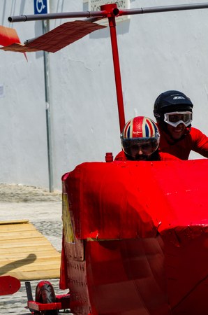 FRIGILIANA, SPAIN - MAY 13, 2018 "Autos Locos" - traditional fun involving the ride of cardboard cars in small spanish town, self-made vehicles, creative and cheerful eventのeditorial素材
