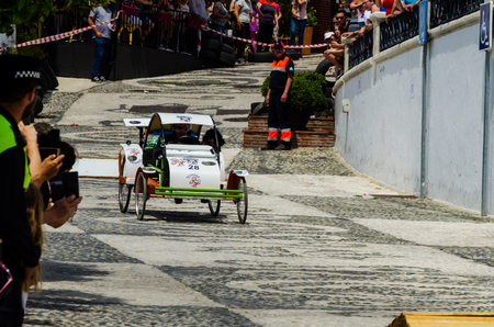 FRIGILIANA, SPAIN - MAY 13, 2018 "Autos Locos" - traditional fun involving the ride of cardboard cars in small spanish town, self-made vehicles, creative and cheerful eventのeditorial素材