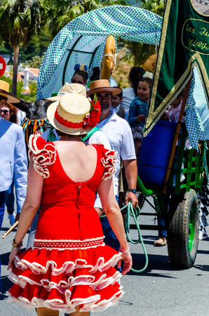 NERJA, SPAIN - 15 MAY, 2018 people participating in the Catholic ceremony of transferring the holy figure in Spainのeditorial素材