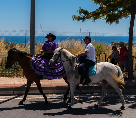 NERJA, SPAIN - 15 MAY, 2018 people participating in the Catholic ceremony of transferring the holy figure in Spainのeditorial素材