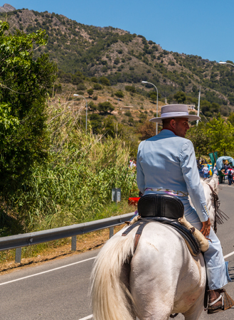 NERJA, SPAIN - 15 MAY, 2018 people participating in the Catholic ceremony of transferring the holy figure in Spainのeditorial素材