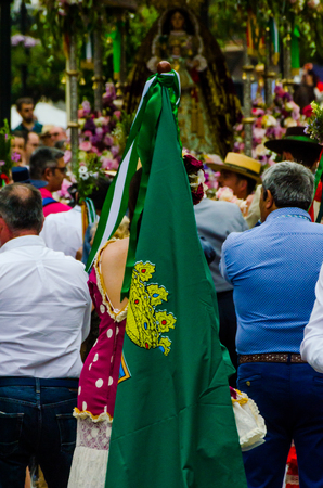 VELEZ MALAGA, SPAIN - MAY 19, 2018 people participating in the celebration of the Catholic ceremony of transferring the holy figure in Spainのeditorial素材