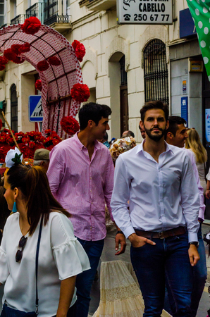 VELEZ MALAGA, SPAIN - MAY 19, 2018 people participating in the celebration of the Catholic ceremony of transferring the holy figure in Spainのeditorial素材