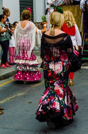 VELEZ MALAGA, SPAIN - MAY 19, 2018 people participating in the celebration of the Catholic ceremony of transferring the holy figure in Spainのeditorial素材