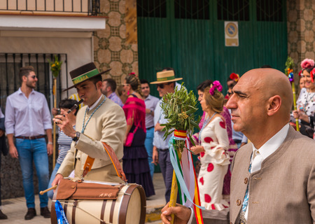 VELEZ MALAGA, SPAIN - MAY 19, 2018 people participating in the celebration of the Catholic ceremony of transferring the holy figure in Spainのeditorial素材