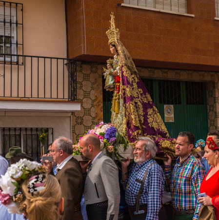VELEZ MALAGA, SPAIN - MAY 19, 2018 people participating in the celebration of the Catholic ceremony...