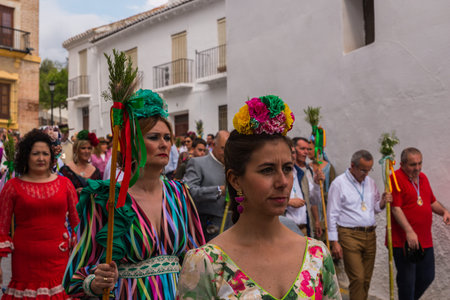 VELEZ MALAGA, SPAIN - MAY 19, 2018 people participating in the celebration of the Catholic ceremony...