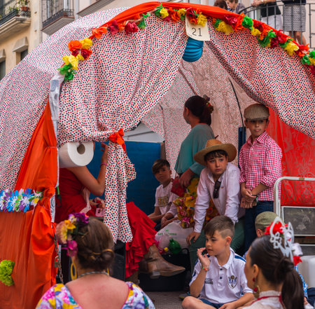 VELEZ MALAGA, SPAIN - MAY 19, 2018 people participating in the celebration of the Catholic ceremony...