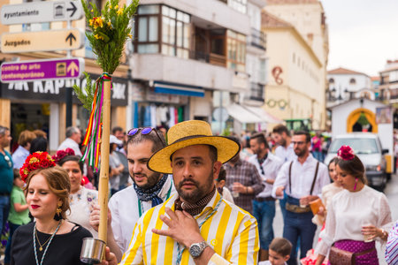 VELEZ MALAGA, SPAIN - MAY 19, 2018 people participating in the celebration of the Catholic ceremony...