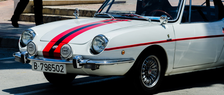 TORRE DEL MAR, SPAIN - JUNE 3, 2018 Old antique cars issued for tourists visiting a seaside town in Spainのeditorial素材