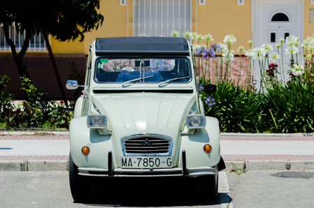 TORRE DEL MAR, SPAIN - JUNE 3, 2018 Old antique cars issued for tourists visiting a seaside town in...