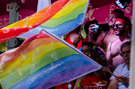 TORREMOLINOS, SPAIN - JUNE 2, 2018 LGBT march promoting equality and tolerance in a coastal town in Andaluciaのeditorial素材