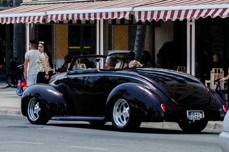 TORRE DEL MAR, SPAIN - JUNE 3, 2018 Old antique cars issued for tourists visiting a seaside town in Spainのeditorial素材