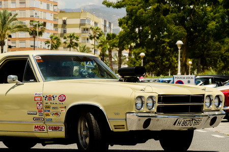 TORRE DEL MAR, SPAIN - JUNE 3, 2018 Old antique cars issued for tourists visiting a seaside town in Spainのeditorial素材