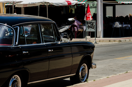TORRE DEL MAR, SPAIN - JUNE 3, 2018 Old antique cars issued for tourists visiting a seaside town in Spainのeditorial素材