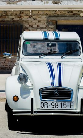 TORRE DEL MAR, SPAIN - JUNE 3, 2018 Old antique cars issued for tourists visiting a seaside town in Spainのeditorial素材