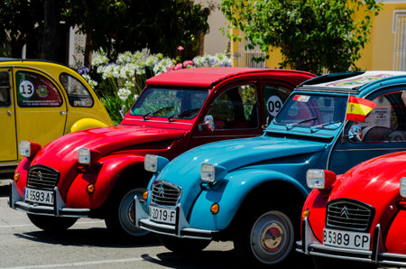 TORRE DEL MAR, SPAIN - JUNE 3, 2018 Old antique cars issued for tourists visiting a seaside town in...
