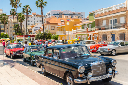 TORRE DEL MAR, SPAIN - JUNE 3, 2018 Old antique cars issued for tourists visiting a seaside town in Spainのeditorial素材