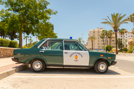 TORRE DEL MAR, SPAIN - JUNE 3, 2018 Old antique cars issued for tourists visiting a seaside town in Spainのeditorial素材