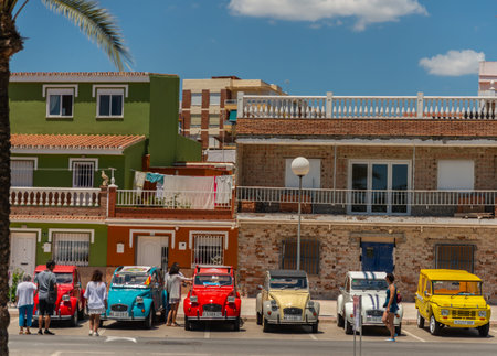 TORRE DEL MAR, SPAIN - JUNE 3, 2018 Old antique cars issued for tourists visiting a seaside town in...
