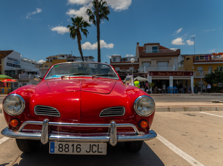TORRE DEL MAR, SPAIN - JUNE 3, 2018 Old antique cars issued for tourists visiting a seaside town in Spainのeditorial素材