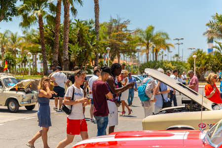 TORRE DEL MAR, SPAIN - JUNE 3, 2018 Old antique cars issued for tourists visiting a seaside town in Spainのeditorial素材