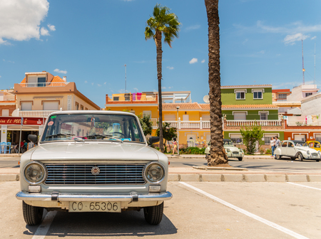 TORRE DEL MAR, SPAIN - JUNE 3, 2018 Old antique cars issued for tourists visiting a seaside town in Spainのeditorial素材