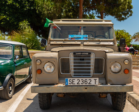 TORRE DEL MAR, SPAIN - JUNE 3, 2018 Old antique cars issued for tourists visiting a seaside town in...