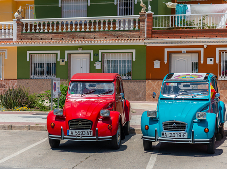 TORRE DEL MAR, SPAIN - JUNE 3, 2018 Old antique cars issued for tourists visiting a seaside town in Spainのeditorial素材