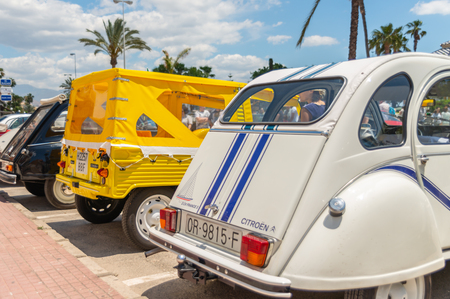 TORRE DEL MAR, SPAIN - JUNE 3, 2018 Old antique cars issued for tourists visiting a seaside town in Spainのeditorial素材