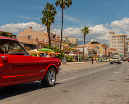 TORRE DEL MAR, SPAIN - JUNE 3, 2018 Old antique cars issued for tourists visiting a seaside town in Spainのeditorial素材
