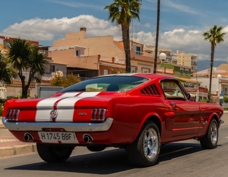 TORRE DEL MAR, SPAIN - JUNE 3, 2018 Old antique cars issued for tourists visiting a seaside town in...