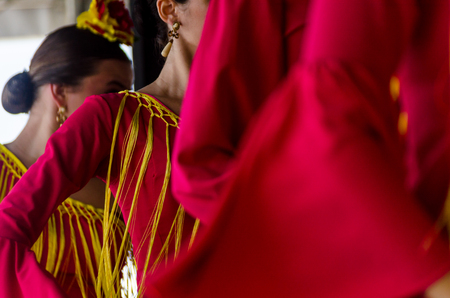 TORRE DEL MAR, SPAIN - JULY 22, 2018 show of Latin dance performed by a dance group in the rhythm of Spanish music, youth in folk costumes performing in front of the audience, dance showのeditorial素材
