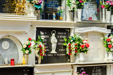 COMARES, SPAIN - 28 JUNE 2018 characteristic of the Spanish burial site in the walls, typical graves in the region of Andalusia, Christianityのeditorial素材