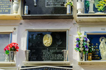 COMARES, SPAIN - 28 JUNE 2018 characteristic of the Spanish burial site in the walls, typical graves in the region of Andalusia, Christianityのeditorial素材
