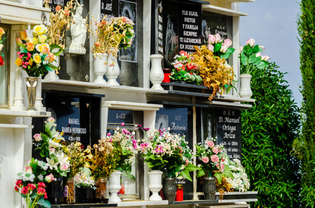 COMARES, SPAIN - 28 JUNE 2018 characteristic of the Spanish burial site in the walls, typical graves in the region of Andalusia, Christianityのeditorial素材