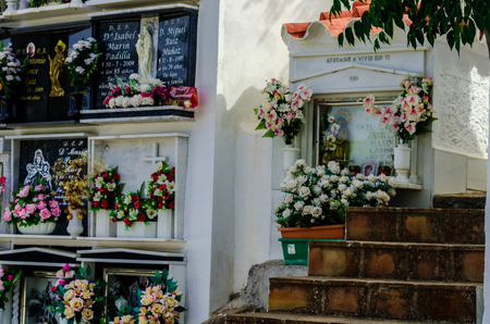 COMARES, SPAIN - 28 JUNE 2018 characteristic of the Spanish burial site in the walls, typical graves in the region of Andalusia, Christianityのeditorial素材