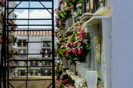 COMARES, SPAIN - 28 JUNE 2018 characteristic of the Spanish burial site in the walls, typical graves in the region of Andalusia, Christianityのeditorial素材