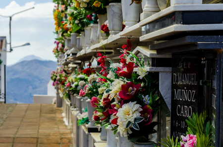 COMARES, SPAIN - 28 JUNE 2018 characteristic of the Spanish burial site in the walls, typical graves in the region of Andalusia, Christianityのeditorial素材