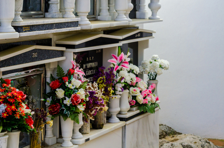 COMARES, SPAIN - 28 JUNE 2018 characteristic of the Spanish burial site in the walls, typical graves in the region of Andalusia, Christianityのeditorial素材