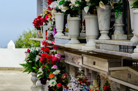 COMARES, SPAIN - 28 JUNE 2018 characteristic of the Spanish burial site in the walls, typical graves in the region of Andalusia, Christianityのeditorial素材