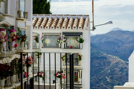 COMARES, SPAIN - 28 JUNE 2018 characteristic of the Spanish burial site in the walls, typical graves in the region of Andalusia, Christianityのeditorial素材