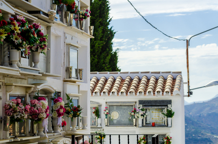 COMARES, SPAIN - 28 JUNE 2018 characteristic of the Spanish burial site in the walls, typical graves in the region of Andalusia, Christianityのeditorial素材