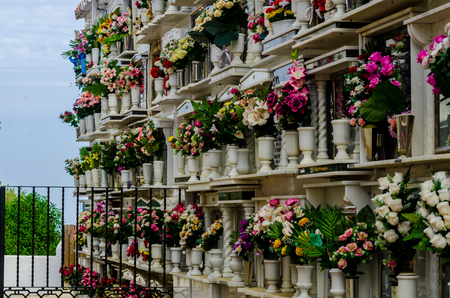 COMARES, SPAIN - 28 JUNE 2018 characteristic of the Spanish burial site in the walls, typical graves in the region of Andalusia, Christianityのeditorial素材